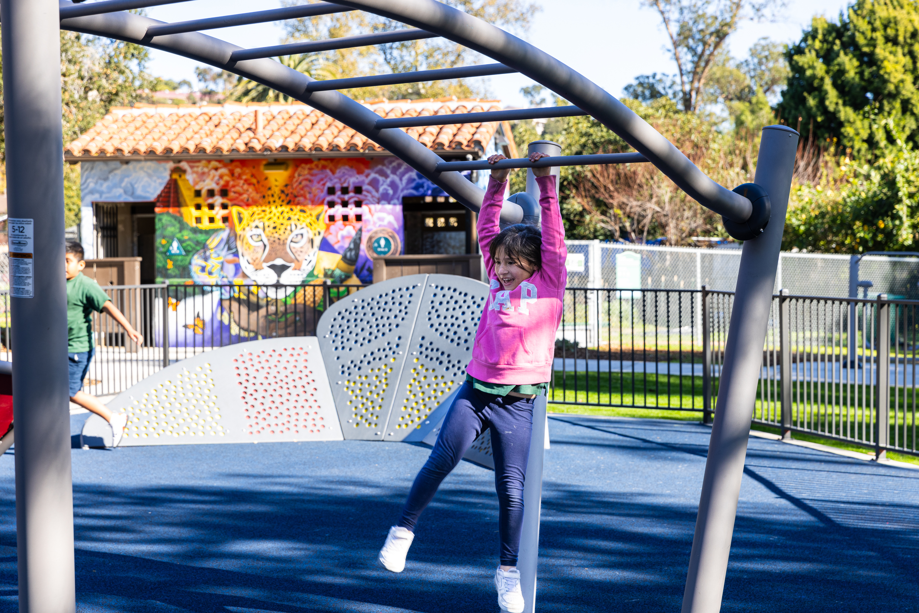 A child played on the new playground at Eastside Neighborhood Park