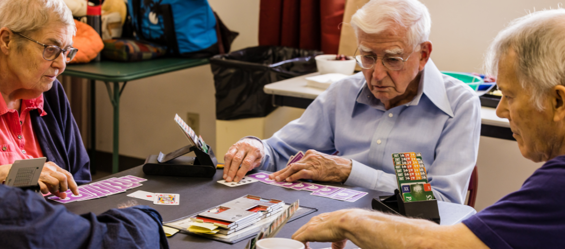 Community members play duplicate bridge at the Westside Neighborhood Center