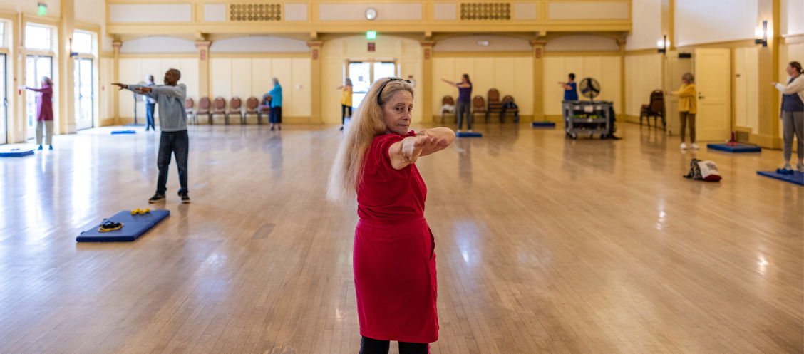 Stretch and Tone instructor leads the group in the Carrillo Ballroom