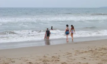 Children playing in the surf at the beach