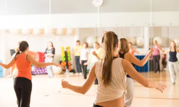 Women exercise in dance studio