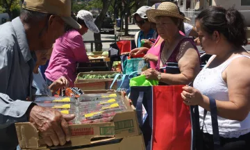 Community members attend a Food Distribution
