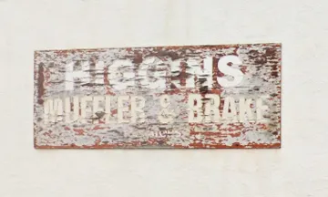 Higgins Muffler & Brake sign