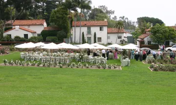 Tables and chairs setup for an event at the Mission Rose Garden