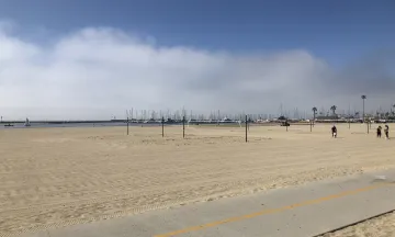 Volleyball courts at West Beach with Harbor in the background