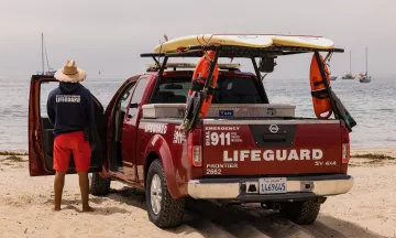 Lifeguard and lifeguard truck at East Beach