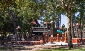 Kids World playground surrounded by trees