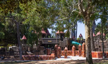 Kids World playground surrounded by trees