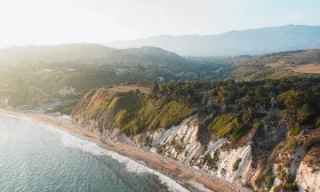 Aerial view shows the cliffs and trails of the Douglas Family Preserve over the ocean