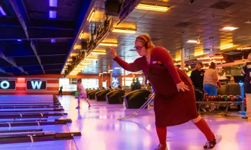 Adapted Recreation participant bowls at Bowlero