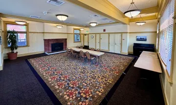 Carrillo Recreation Center Meeting Room with table and chairs set up in the center