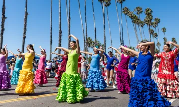 Dancers wearing colorful dresses, showcasing vibrant traditional costumes