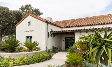 Casa Las Palmas entrance with walkway lined with plants