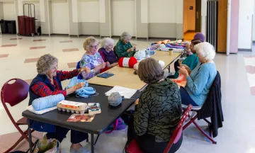 A group of women knitting together at the Westside Neighborhood Center