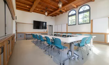 Training Room at the Cabrillo Pavilion with tables and chairs, whiteboards, and a presentation TV