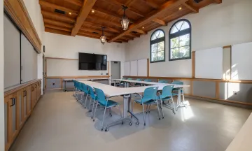 Training Room at the Cabrillo Pavilion with tables and chairs, whiteboards, and a presentation TV