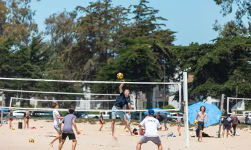 Campers play beach volleyball