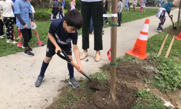 Students help plant new trees for Arbor Day