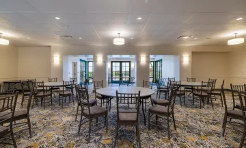 Palm Park Beach House interior with chairs and tables set up
