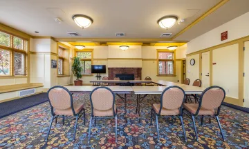 Carrillo Recreation Center Meeting Room with table and chairs set up in the center