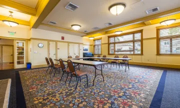 Carrillo Recreation Center Meeting Room with table and chairs set up in the center