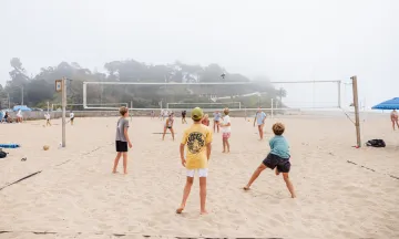 Beach Volleyball campers playing on a foggy day
