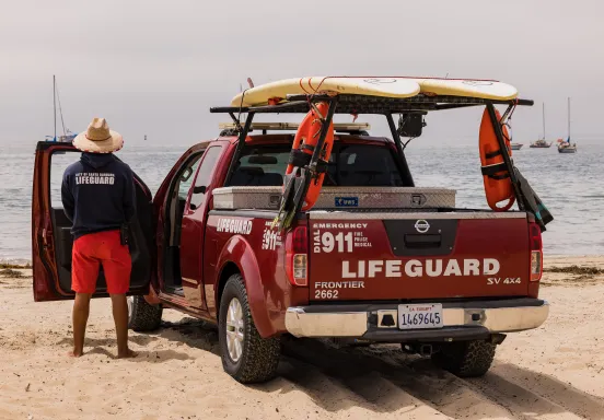 Lifeguard and lifeguard truck at East Beach