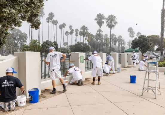Painters from local companies painting the walls of Skater's Point skatepark