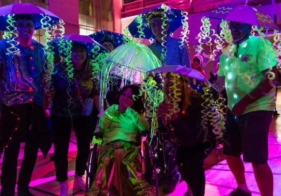 Participants dressed in a group costume as jelly fish pose for the camera