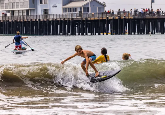 Participants at summer camp enjoy different water activities near Stearns Wharf