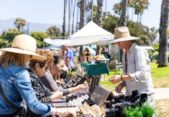 Vistiors to the Santa Barbara Arts and Crafts show browse handmade items