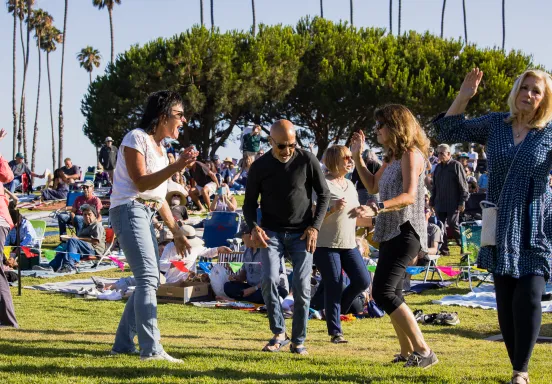 People dancing during Concerts in the Park at Chase Palm Park 