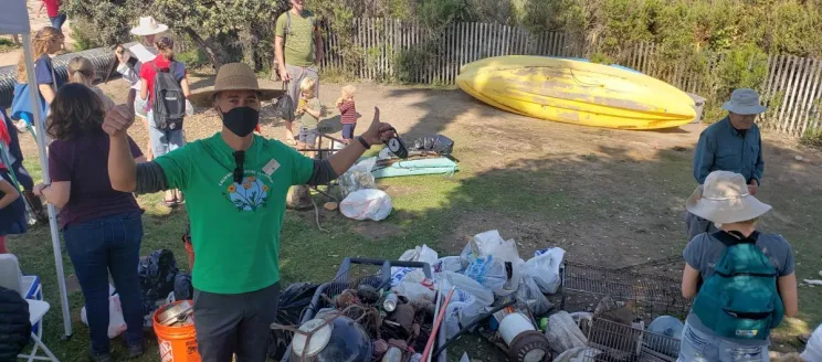 Coastal Cleanup Day participants with trash they've collected.