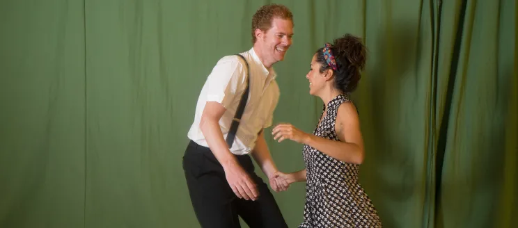 Two people swing dancing
