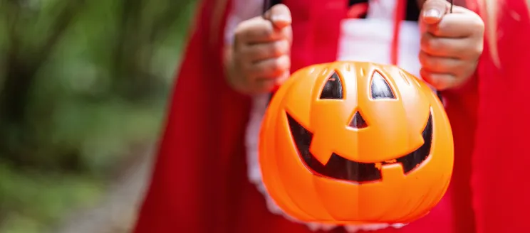 Trick or treater holding candy basket