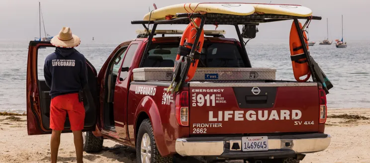 Lifeguard and lifeguard truck at East Beach