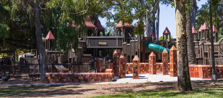 Kids World playground surrounded by trees