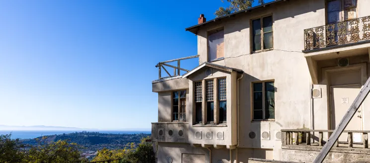Franceschi House with view of city and ocean in the background