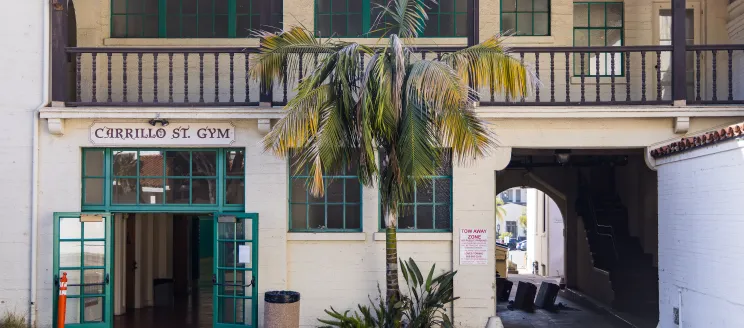 Exterior photo of the Carrillo Street Gymnasium with the front doors propped open
