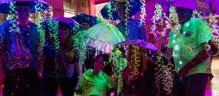 Participants dressed in a group costume as jelly fish pose for the camera