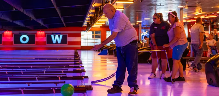 Program participant bowls at the Adapted Recreation Program