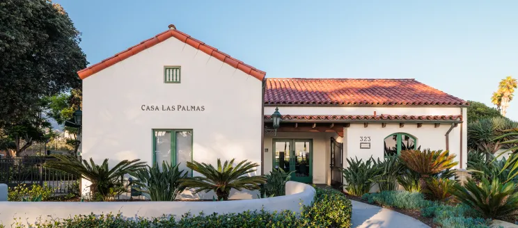 Casa Las Palmas entrance with walkway lined with plants