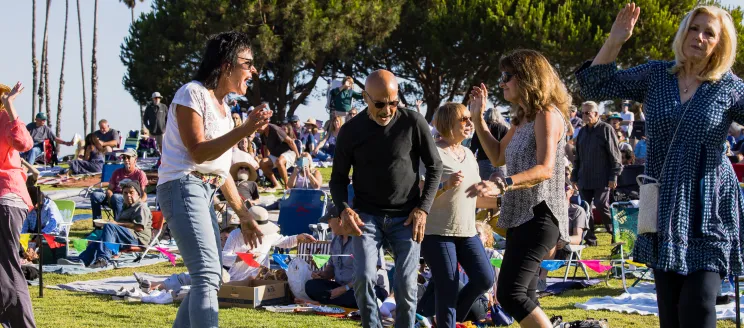 People dancing during Concerts in the Park at Chase Palm Park 