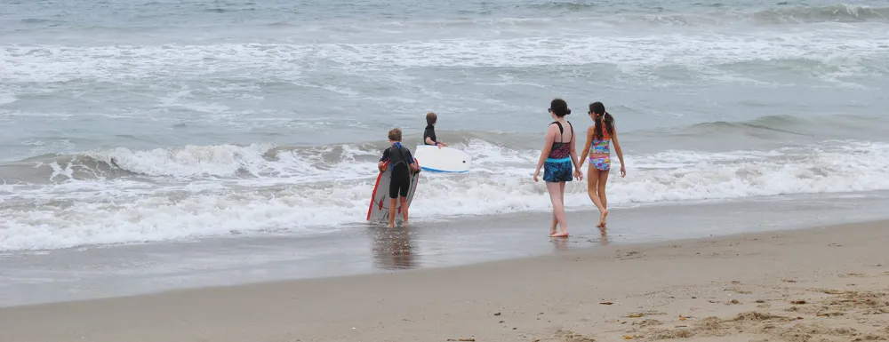 Children playing in the surf at the beach