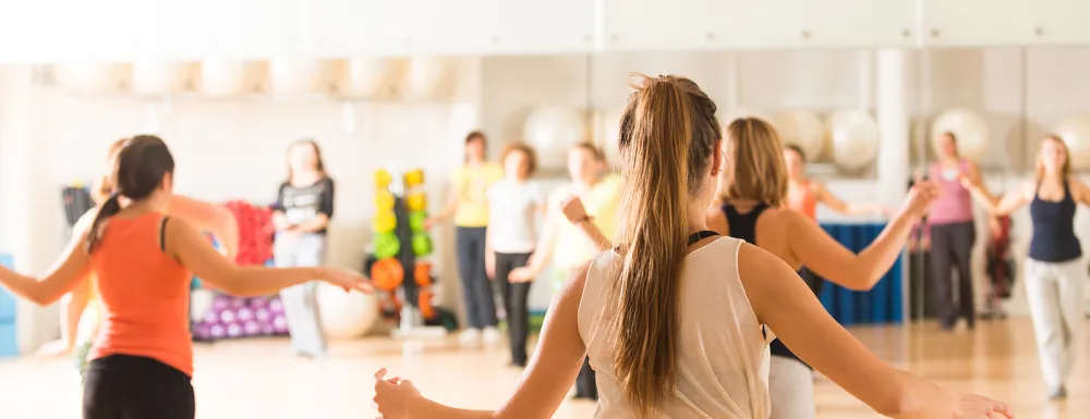 Women exercise in dance studio