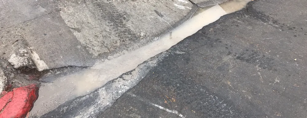 Polluted water in the gutter