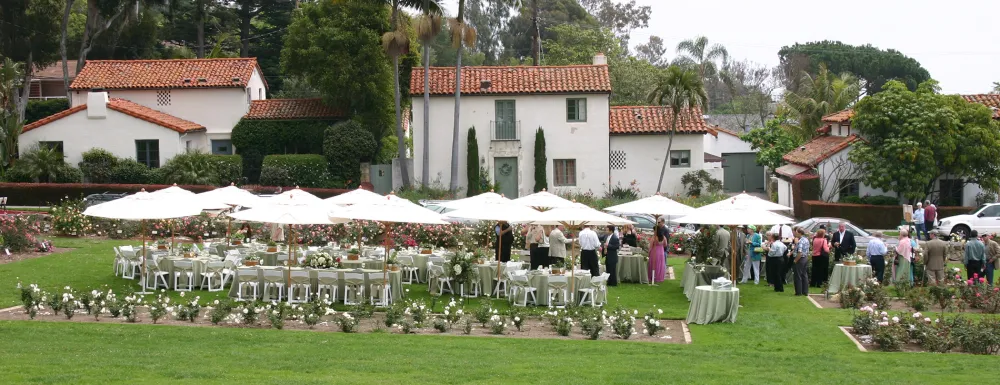 Tables and chairs setup for an event at the Mission Rose Garden