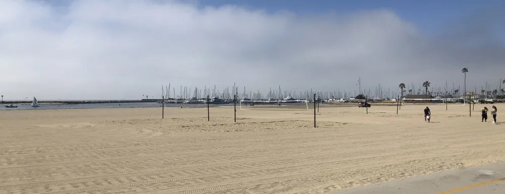 Volleyball courts at West Beach with Harbor in the background