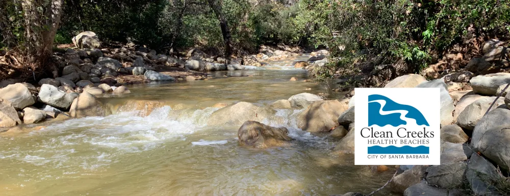 Photo of Mission Creek flowing through Oak Park in Santa Barbara with City of Santa Barbara Creeks Division logo and text "Clean Creeks Healthy Beaches, City of Santa Barbara"