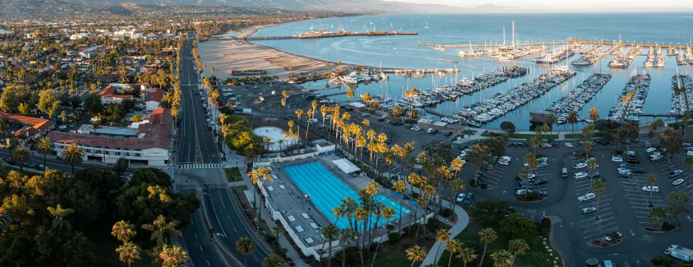 Aerial view of Los Baños del Mar Pool with the city scape and mountains in background